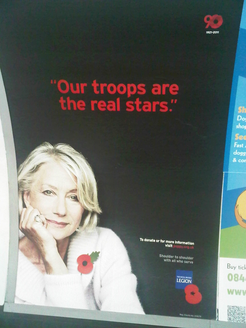 2011 Poppy Appeal billboard featuring Dame Hellen Mirren, a London underground station, November 2011
