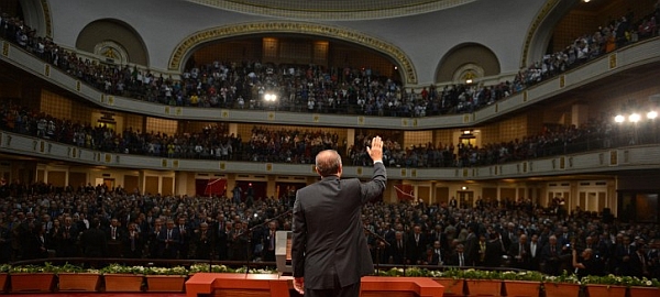 Turkey's Prime Minister Recep Tayyip Erdogan waves to the audience at Cairo University during his visit in Cairo, 17 November 2012